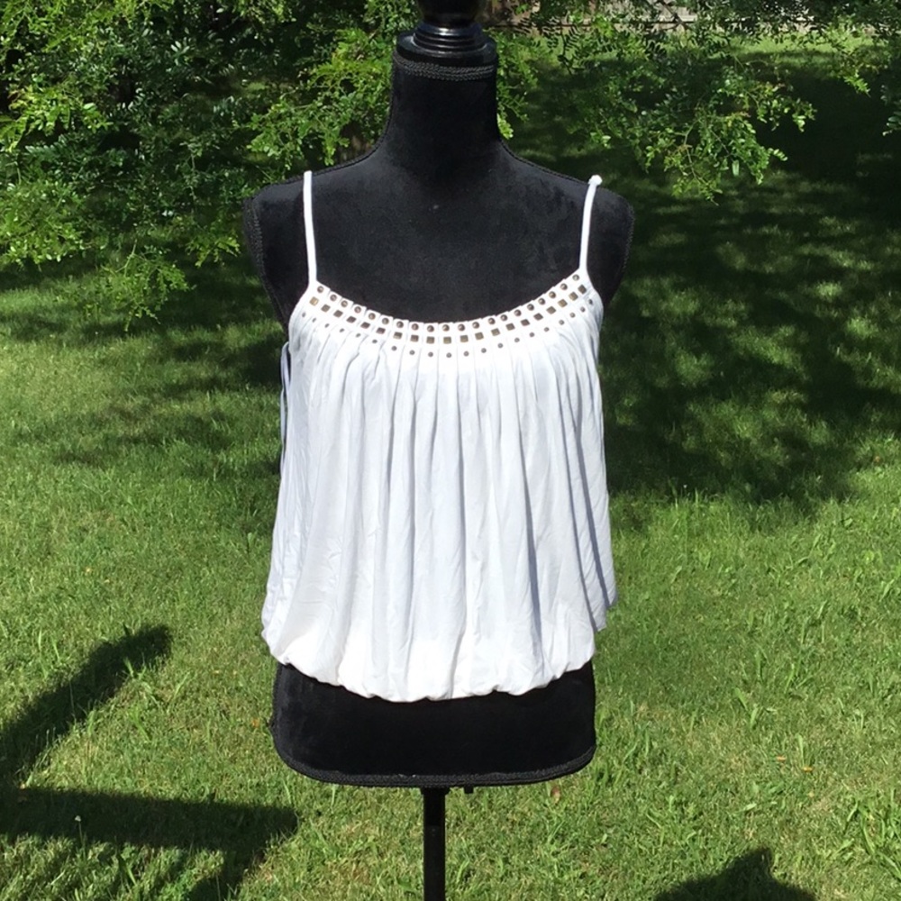 Guc cream color tank with adjustable straps.